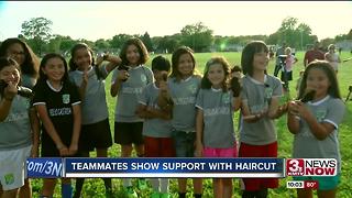 Teammates cut hair for Mili