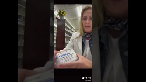 Pharmacist Opens Vaccine Box Insert