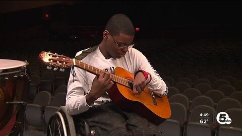 Students 3-D print adaptive guitar device to let classmate play guitar