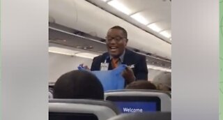 Flight Attendent Sings "Throw Away Your Mask"