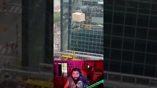 Guy hanging from crane in Toronto!