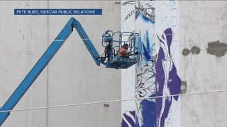 New mural on grain towers in RiNo