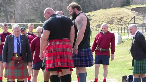 World's Strongest Men in a Tug o' War Challenge at Braemar Gathering Highland Games site in Scotland