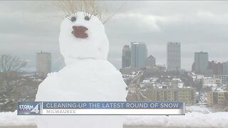 Milwaukee residents clean up the latest round of snow.