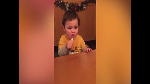 Baby Makes Cute Faces when Eating a Lemon
