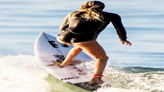 Beautiful girls surfing in the ocean