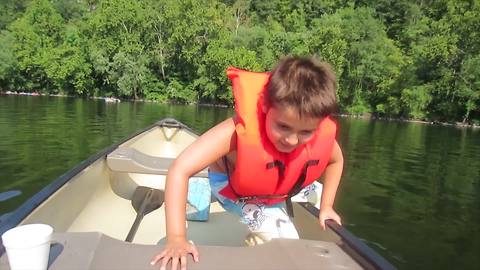 Nervous Boy Jumps Off A Canoe And Flips It Over