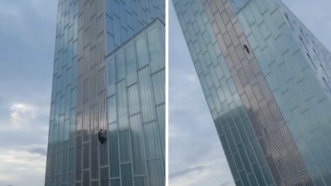Urban climber incredibly scales Barcelona skyscraper