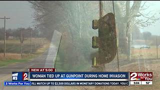 Woman tied up at gunpoint in home invasion