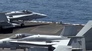 Taking off and landing on the USS George H.W. Bush Aircraft Carrier