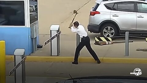 United pilot caught on video hacking away at parking gate with an axe at DIA