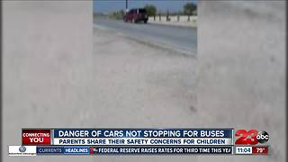 Danger of cars not stopping for buses