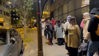 Footage shows hundreds of people waiting in queue for food distribution in French capital Paris