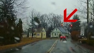 Stopped car runs red light