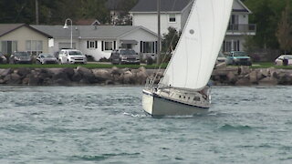 Phoenix Sailboat Rides The Wind Under Bluewater Bridges In Great Lakes