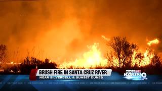Brush fire burning in Santa Cruz River