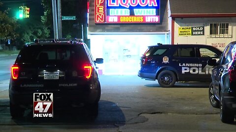 Liquor store robbed at gunpoint in Lansing