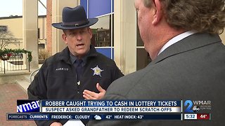 Robber caught trying to cash in lottery tickets