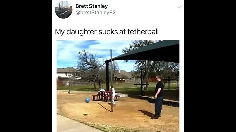 Playing the tether ball with daughter.