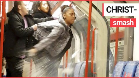 Watch shocking moment woman SMASHES bottle on London tube - showering passengers in shards of glass