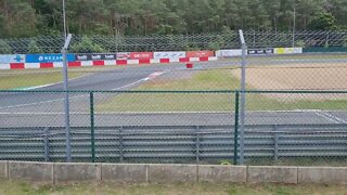 E racers overtaking at Circuit Zolder. Electric car racing