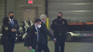 Ex-Michigan Governor Rick Snyder walks into court for his arraignment on charges related to the Flint water investigation