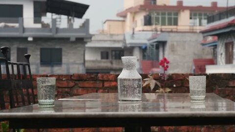 Fall to Sleep By The Table Under Heavy Rain and Thunder Storm On The Roof Top Of Your Building