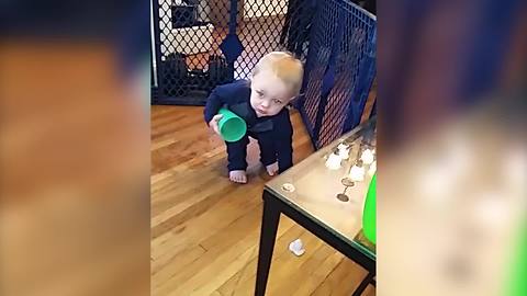 A Tot Boy Drops A Piece Of Ice Each Time He Bends Down To Pick Up One
