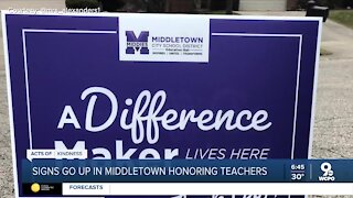 Teachers and staff receiving actual signs of gratitude from school district
