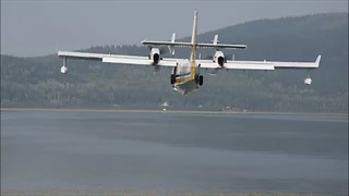 Water Scooping Planes Skim Lake to Fight Fire