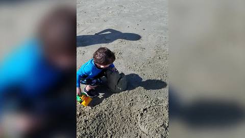 Cute Toddler Boy Destroys Sand Castles