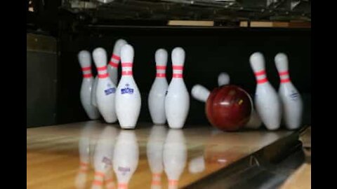 Guy at bowling alley throws himself down the lane