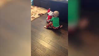 "A Baby Girl Gets Angry At Santa Claus Toy"