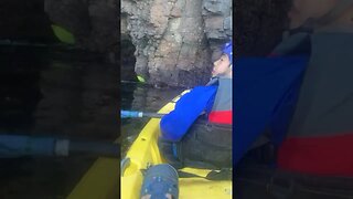 Kayaking inside a sea cave.