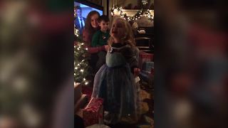 "Tot Girl Sings "Let It Go" But Trips Over Christmas Presents"