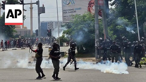 Police fire gunshots, tear gas as thousands protest the crisis in Nigeria