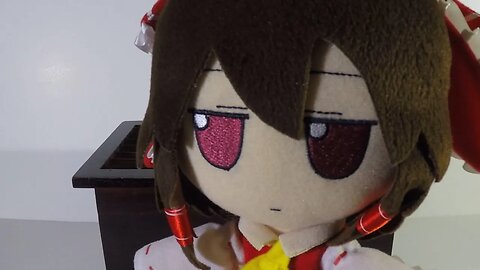 Reimu checks her offertory box