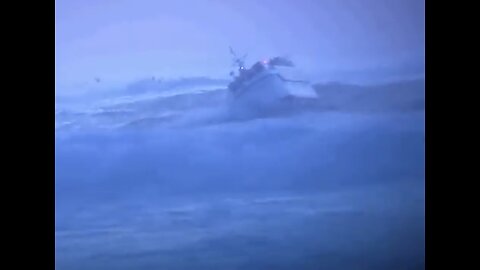 Small fishing vessel coming in harbor in Heavy Seas.