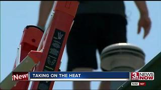 Roofers take on the heat to fix hail damage