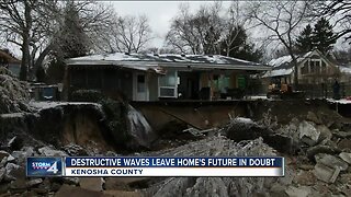 Crews work to rebuild shore underneath house destroyed by waves