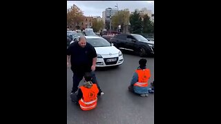 Climate activists being forcibly removed from the road
