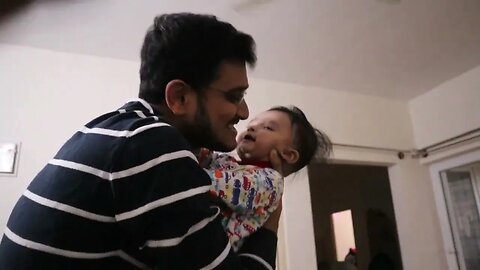 6 months old baby gets excited to go out for a walk with father