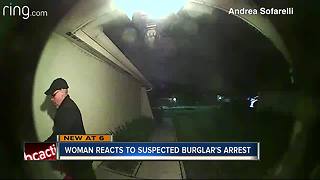 Woman reacts to suspected burglar's arrest