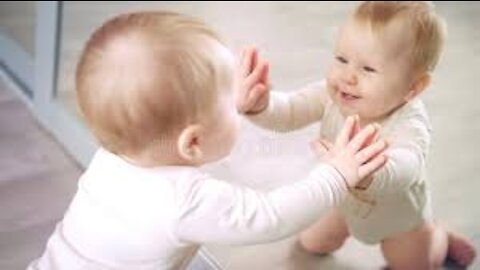 funny baby frst time face to mirror