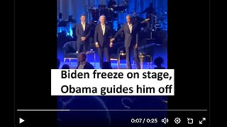 Biden freeze on stage, Obama guides off