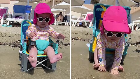 Baby accidentally falls of her beach chair