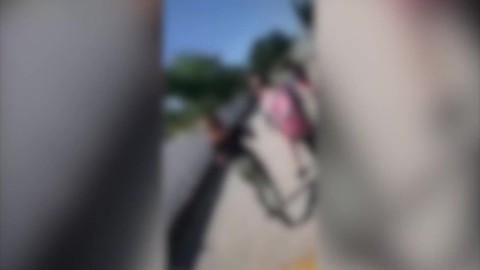 School officials investigating after video shows students fighting at bus stop