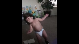 Toddler gets hit with giant ball in epic slow motion