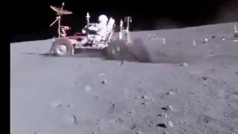 Astronaut John Young riding the lunar roving on the Moon (1972)