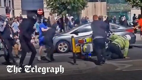 Liverpool riots: Police officer pushed off motorbike and attacked by far-Right supporters